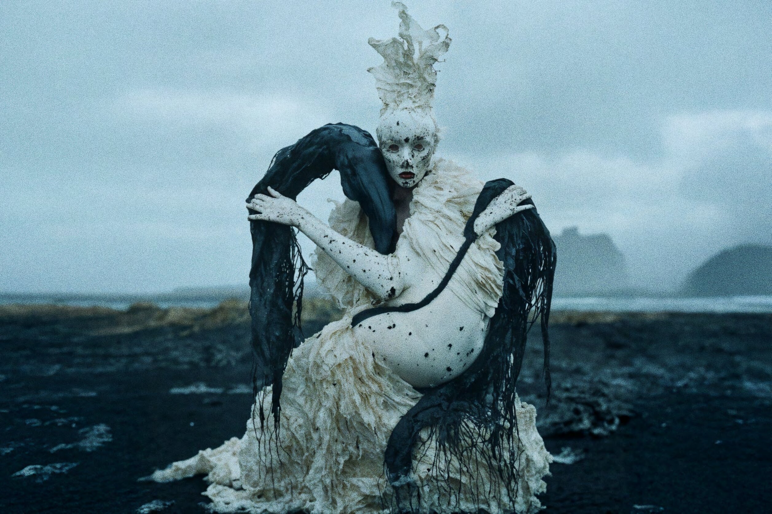 Figure with black drapes