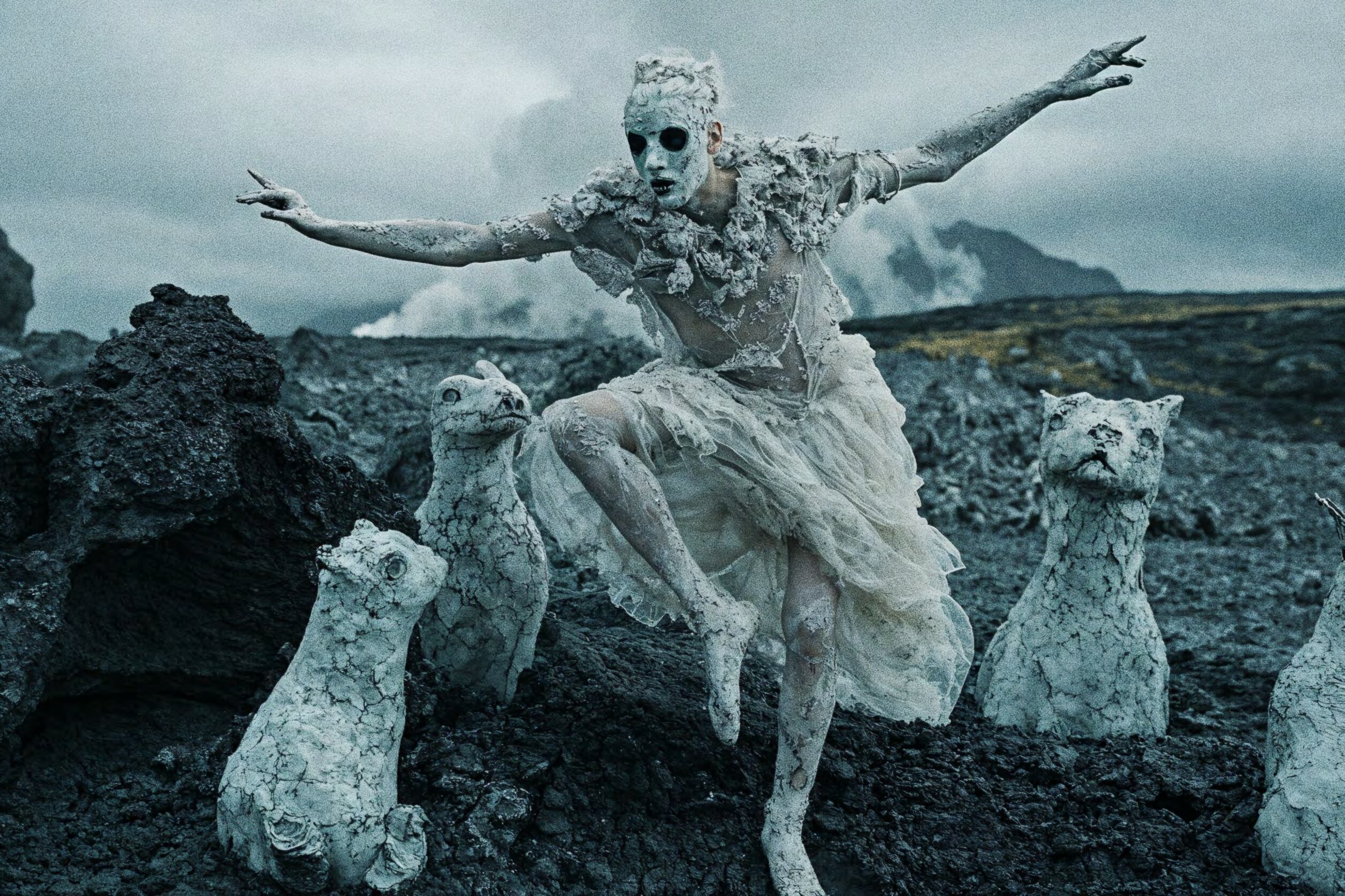 Figure with stone cats